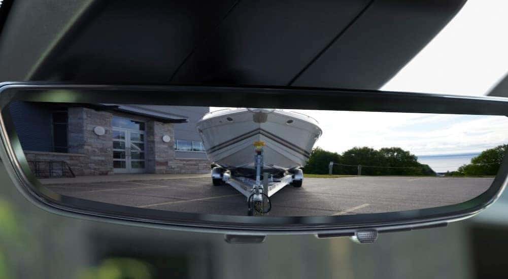 A close-up of the rearview mirror is shown in a Chevy Silverado 2500 HD.
