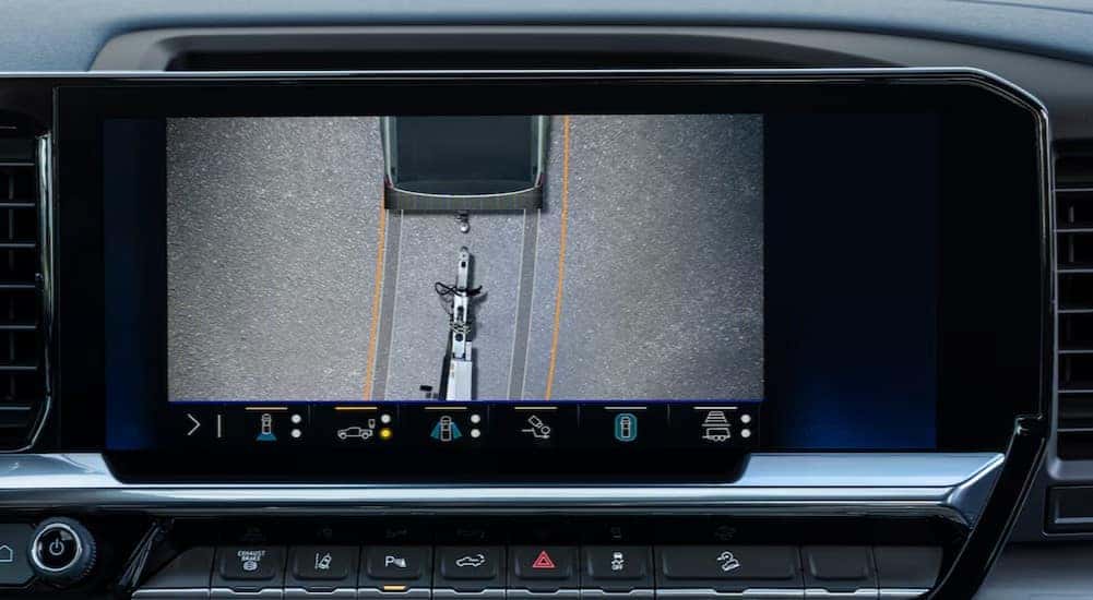 A close-up of the infotainment screen is shown in a Chevy Silverado 2500 for sale.