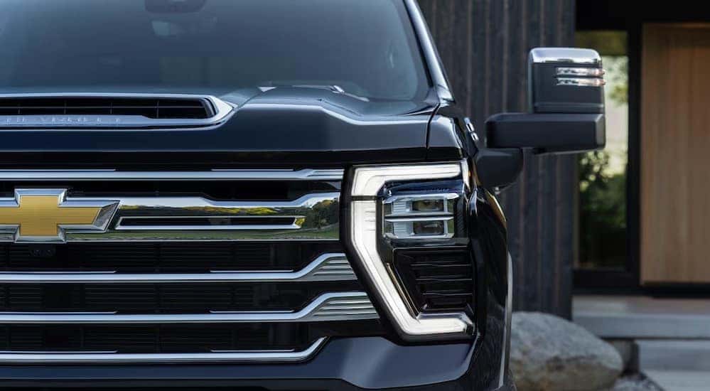 A close-up of the front end is shown on a 2025 Chevy Silverado 2500 High Country.