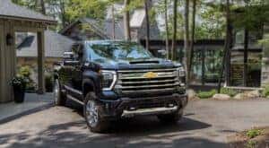 A black 2024 Chevy Silverado 2500 for sale is shown from the front at an angle.