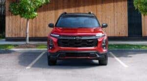 A red 2025 Chevy Equinox RS is shown parked after viewing a Chevy Equinox for sale in Millbrook.