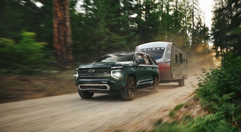 A green 2025 Chevy Tahoe for sale from the front.