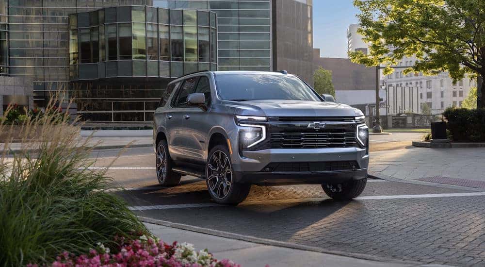 A silver 2025 Chevy Tahoe for sale from the front at an angle.