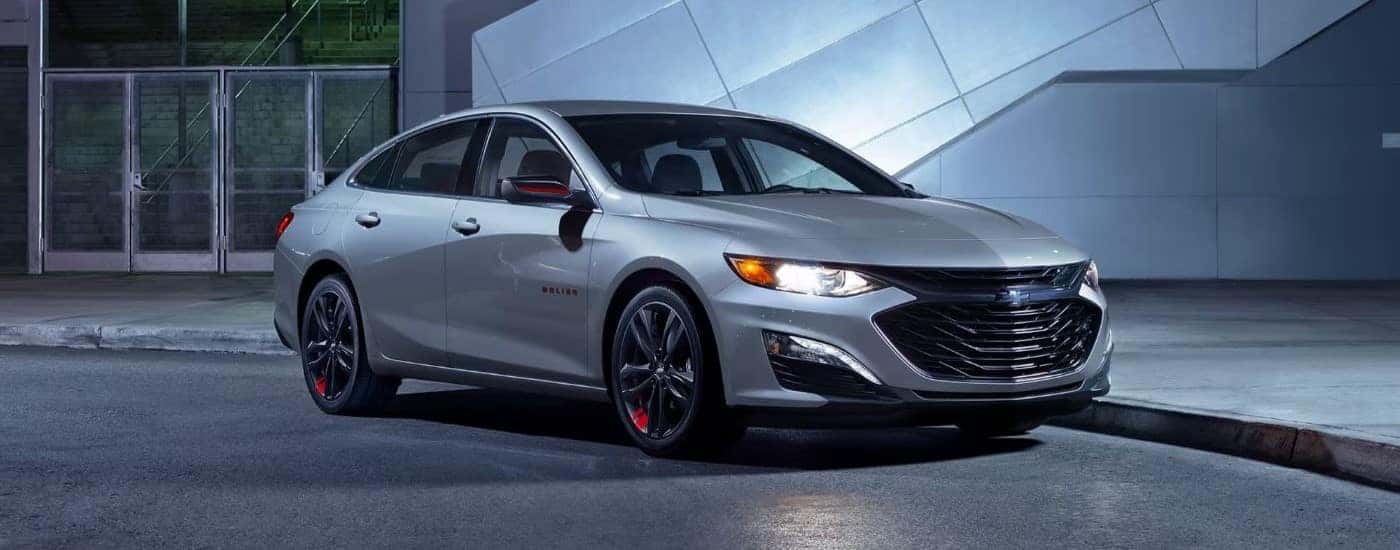 A 2024 Chevy Malibu Redline parked near a Chevy dealer near Amenia.
