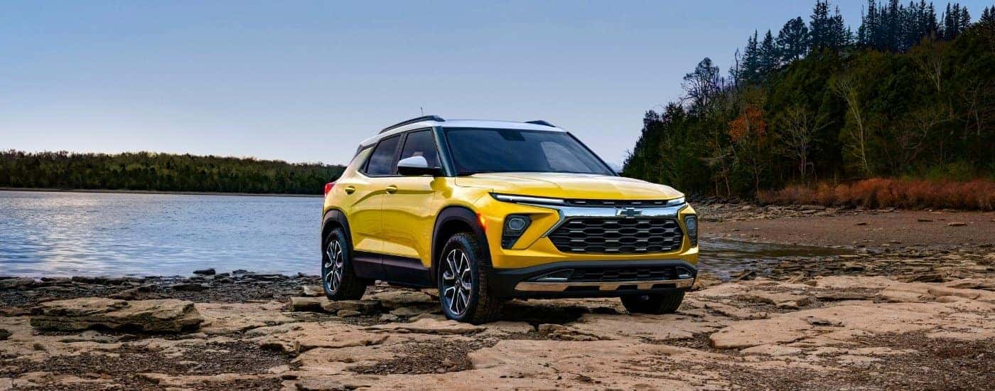 A yellow 2024 Chevy Trailblazer Activ is shown from the front at an angle after leaving a dealer that has a Chevy Trailblazer for sale.