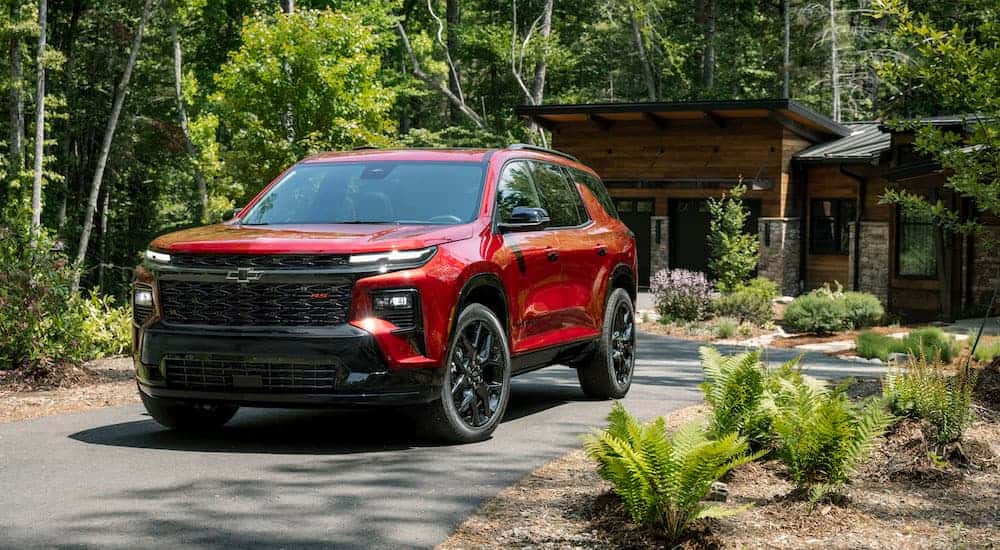A red 2025 Chevy Traverse for sale from the front.