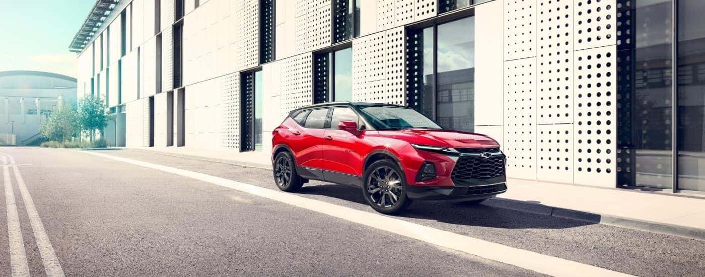 A red 2023 Chevy Blazer from the side used car dealer near Kingston.