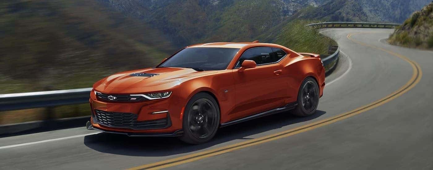 An orange 2019 Chevy Camaro from the side.