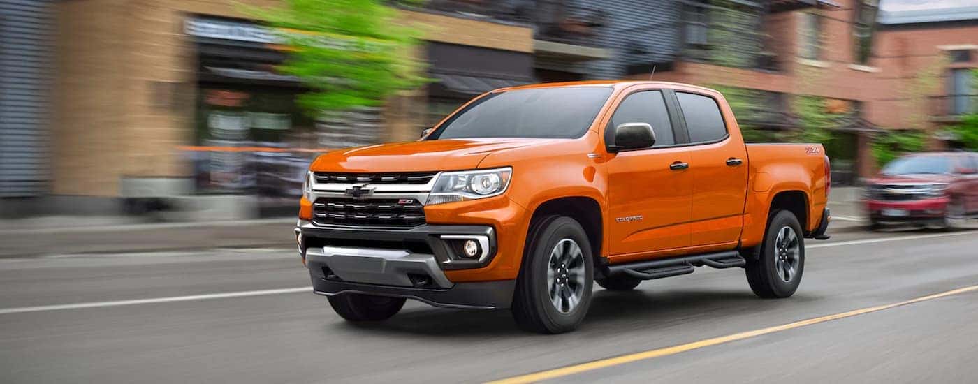 An orange 2021 Chevy Colorado from the side.