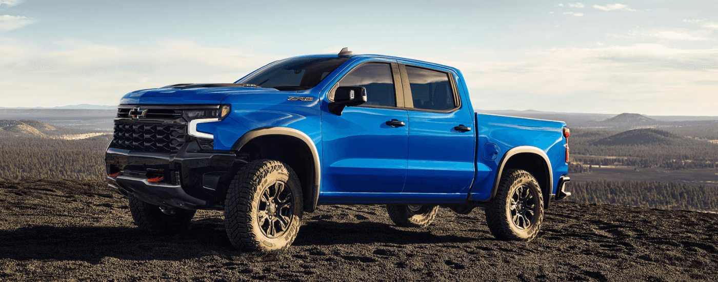 Blue 2025 Chevy Silverado 1500 parked off-road