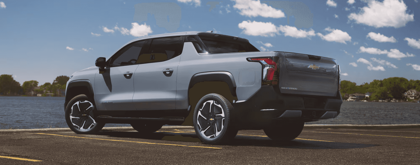 Grey 2025 Chevy Silverado EV parked by the water