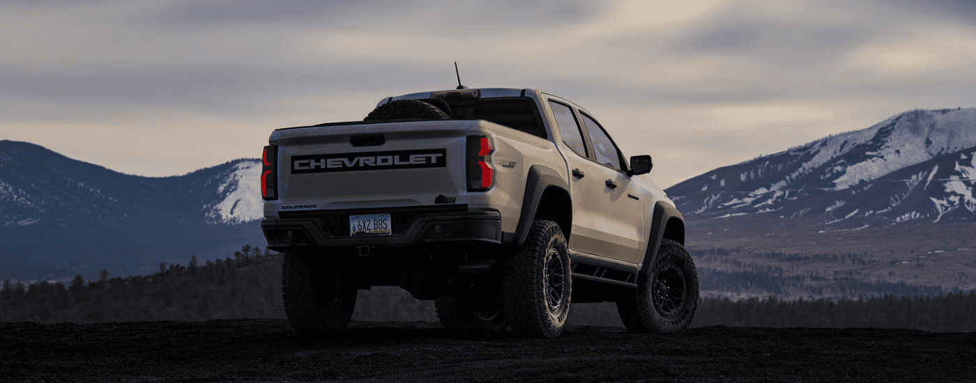 Tan 2025 Chevy Colorado from the rear off-road