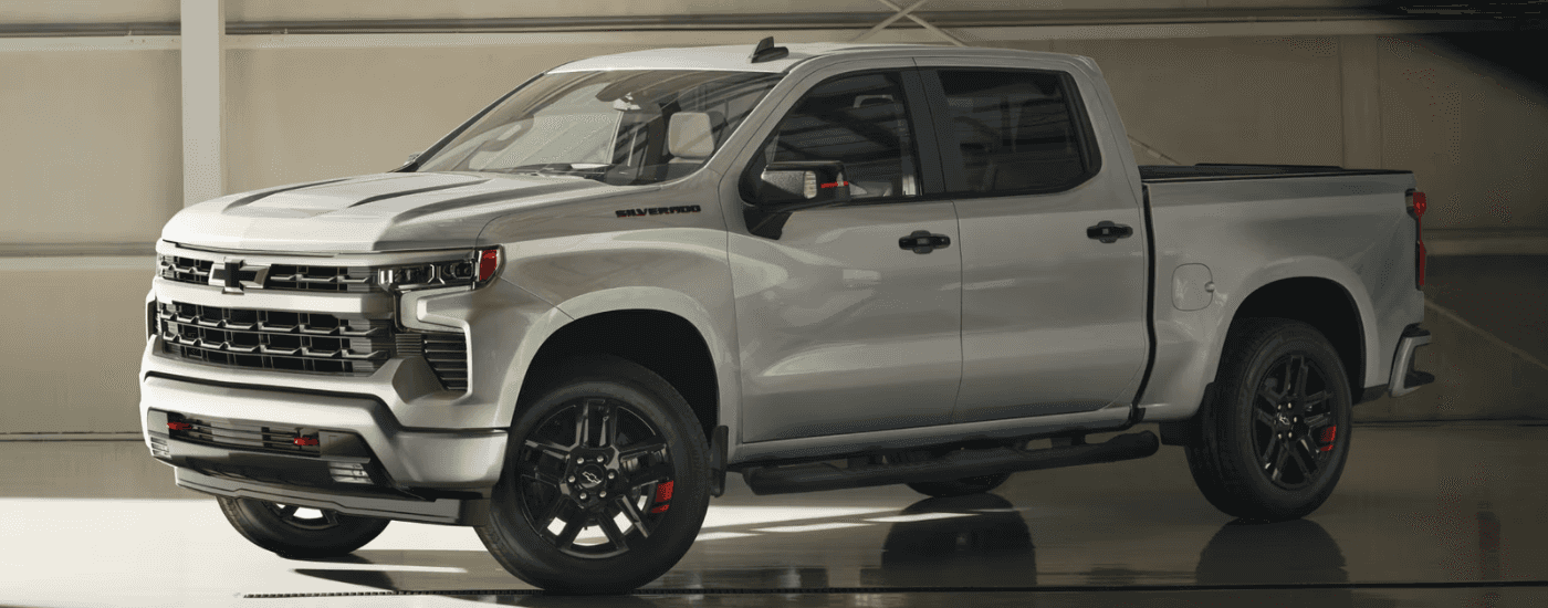 Silver 2025 Chevy Silverado 1500 Redline parked inside