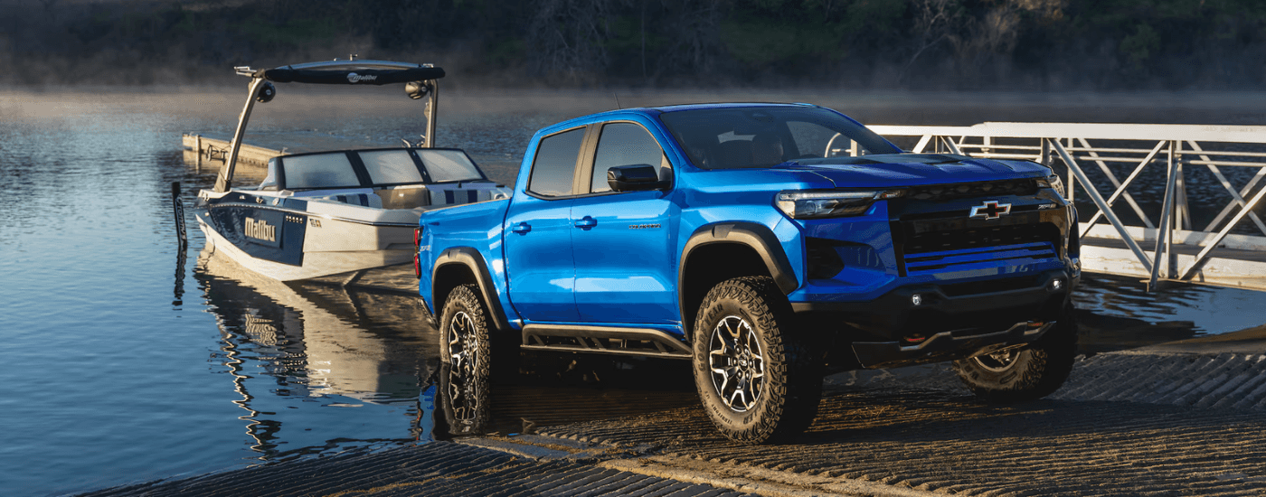 Blue 2026 Chevy Colorado pulling a boat out of water