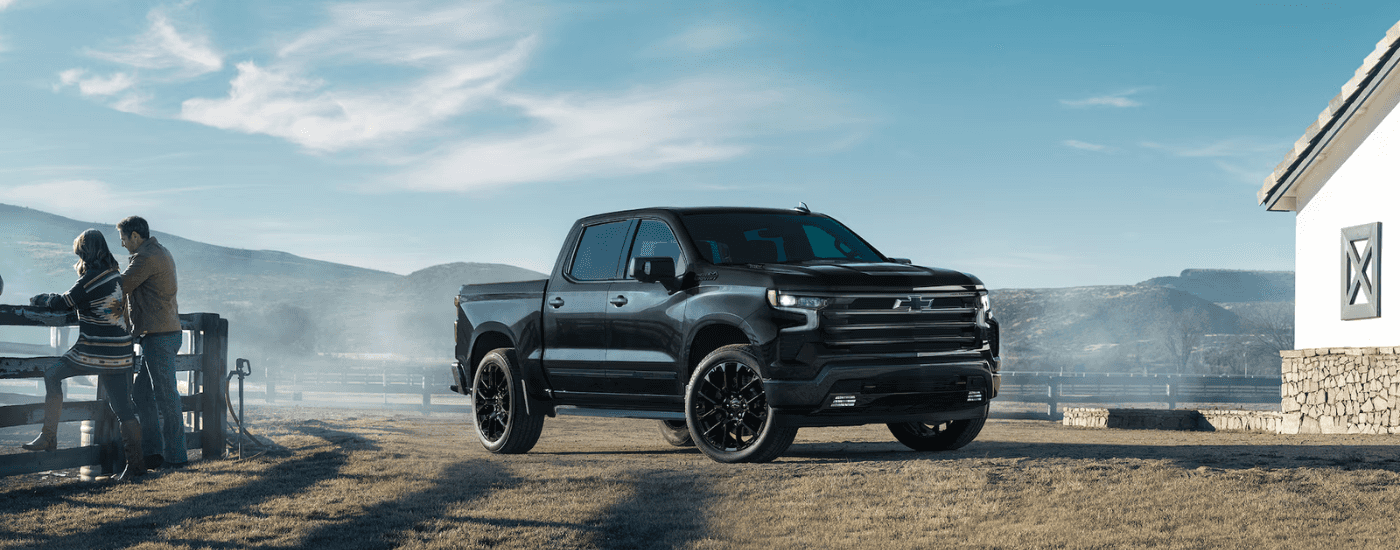 Black 2025 Chevy Silverado 1500 parked on a farm