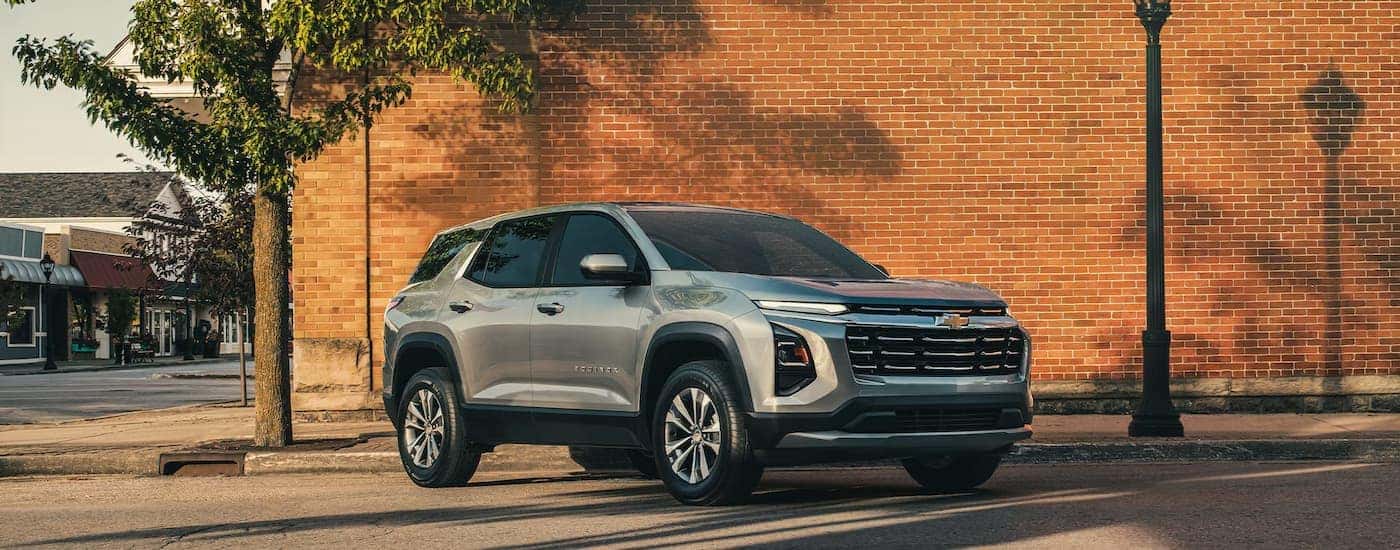 A silver 2026 Chevy Equinox parked in a city