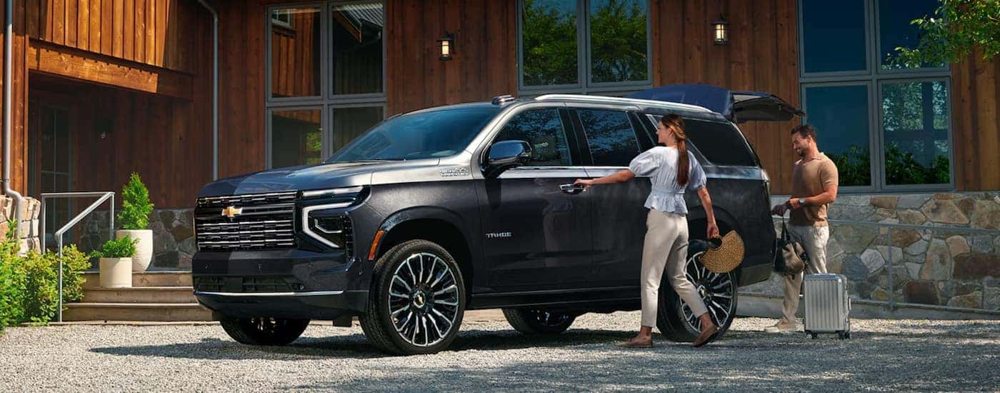 Black 2026 Chevy Tahoe High Country parked on a driveway.