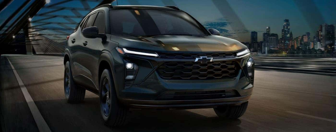 Black 2026 Chevy Trax Midnight Edition driving to a car dealership near Poughkeepsie