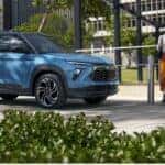 Blue 2026 Chevy Trailblazer with a couple walking to it