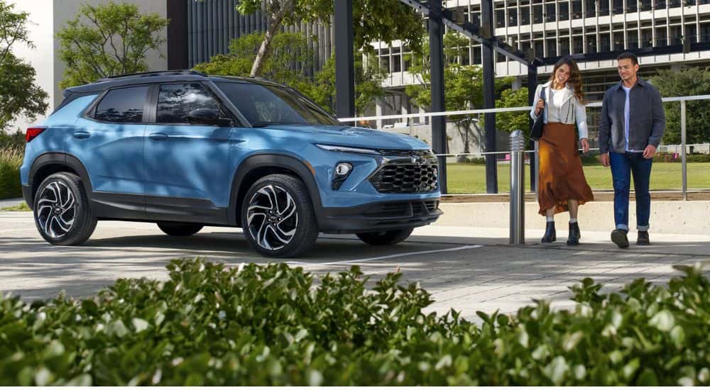 Blue 2026 Chevy Trailblazer with a couple walking to it
