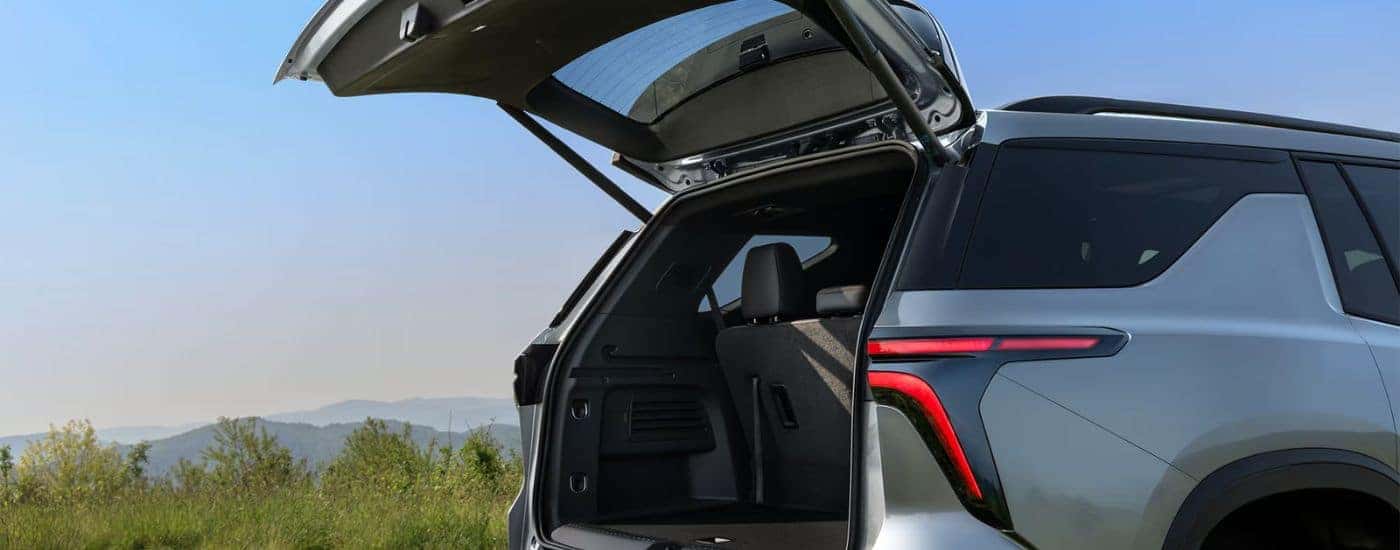 Grey 2026 Chevy Traverse with the cargo lift gate up.