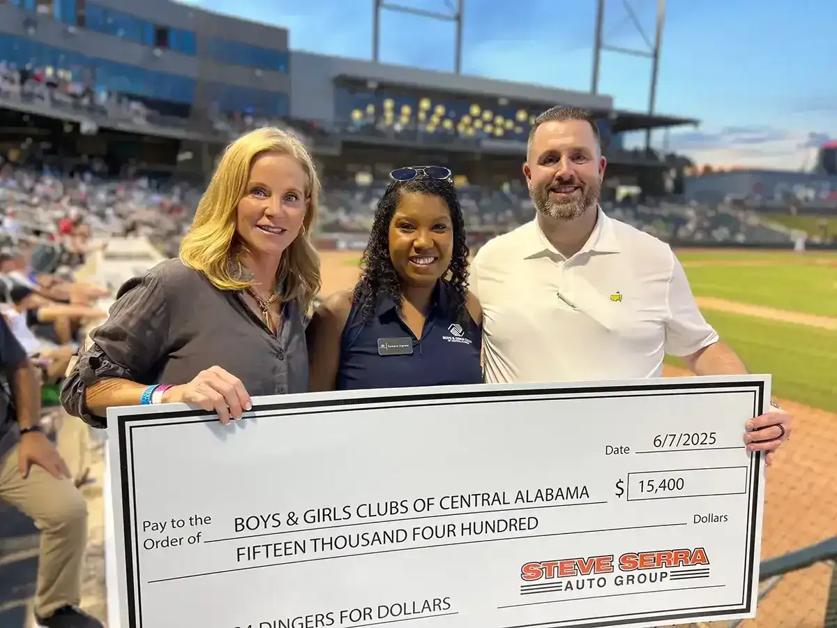 Serra Auto Group presenting check to the boys and girls club