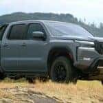 2023 Nissan Frontier in a vast field.