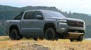 2023 Nissan Frontier in a vast field.