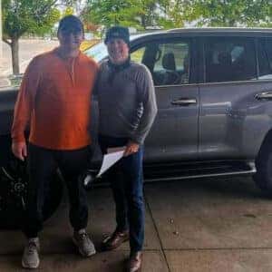 salesmen standing with customer
