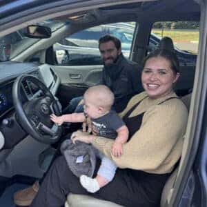 family sitting in car