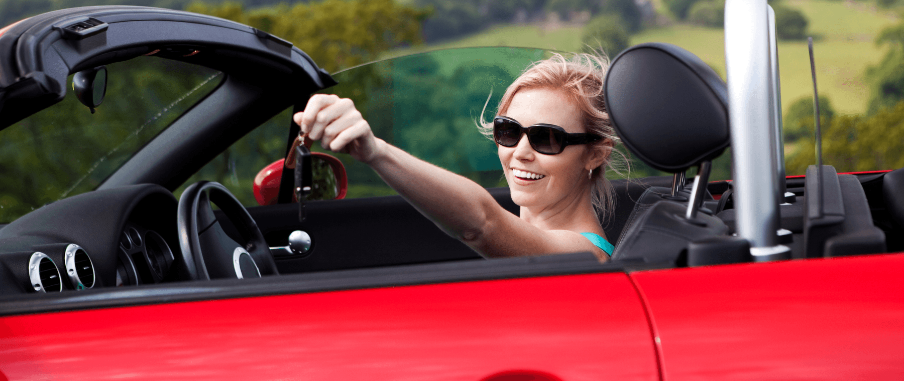 Woman Holding Keys to her used car