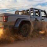 2022 jeep gladiator truck vehicle rear exterior shot of driving through sand dunes