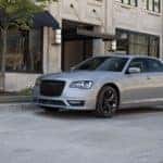 A silver 2022 Chrysler 300 sits on a city street!