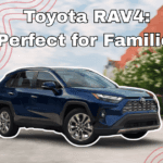 2025 Toyota RAV4 driving down a city street, showcasing its family-friendly design and versatility