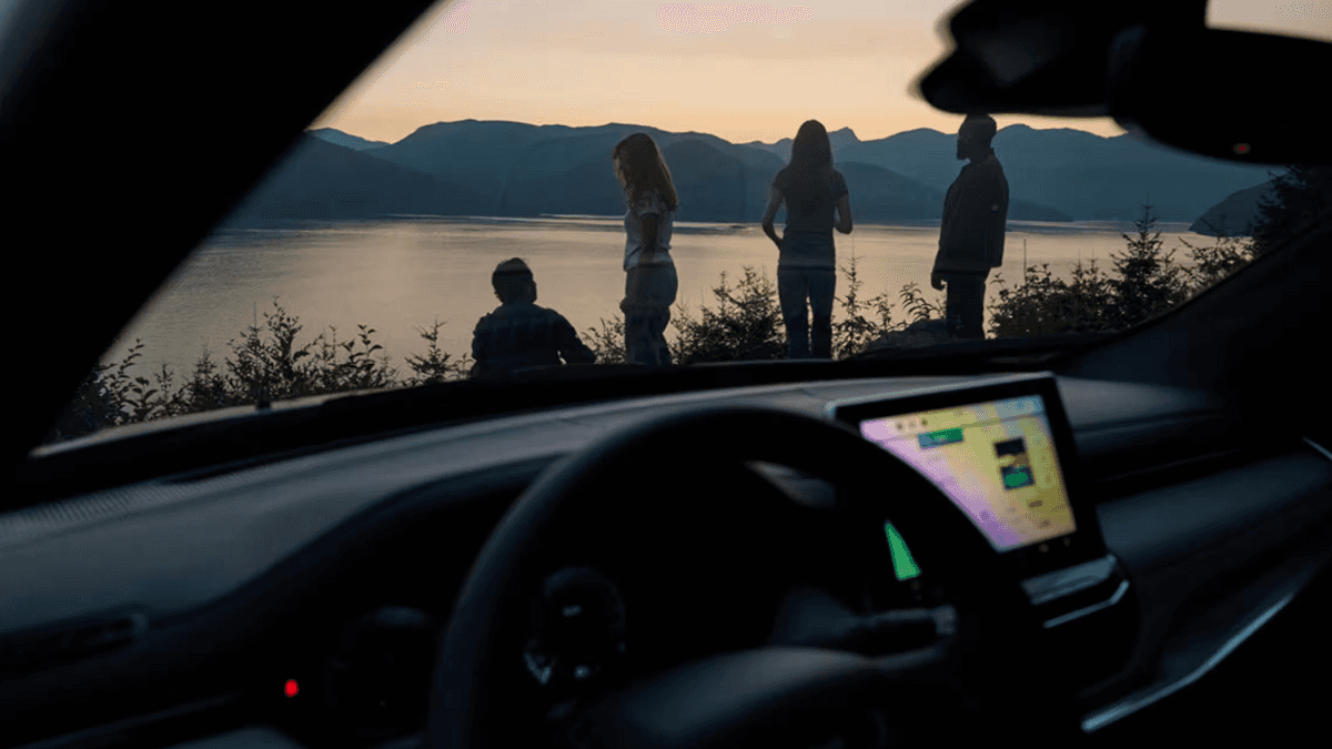 View from inside the new jeep compass of people standing outside by a lake