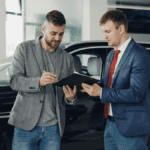 Couple choosing a reliable used car for sale at Transitowne kia in West Seneca