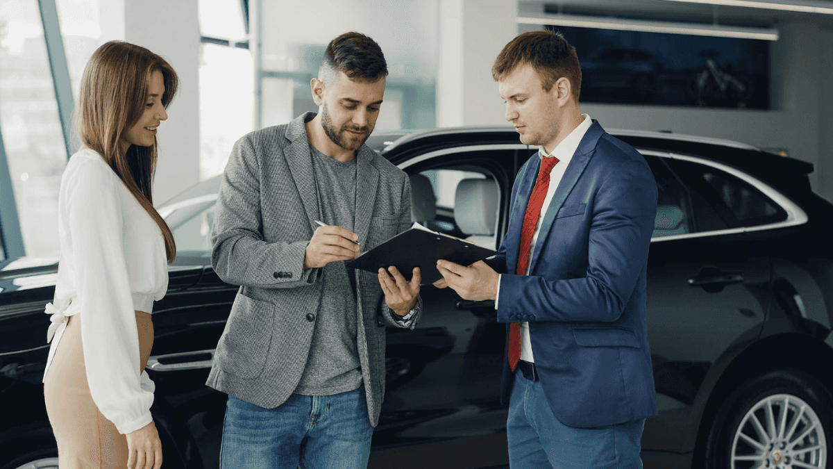 Couple choosing a reliable used car for sale at Transitowne kia in West Seneca