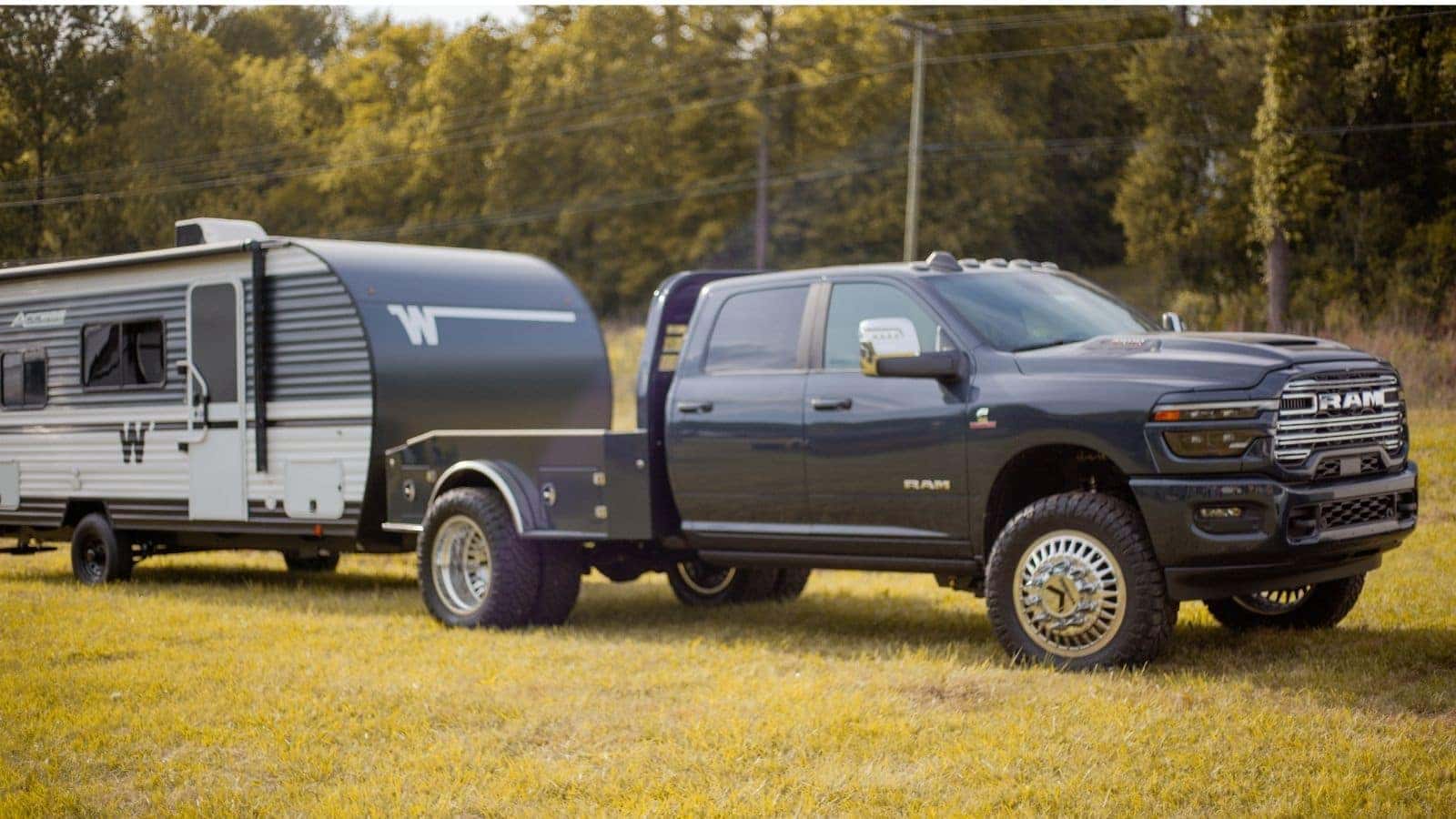 Custom Ram truck towing camper through North Georgia