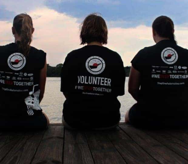 step one team members sitting outside