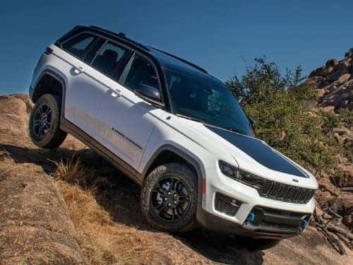 2024 Jeep Grand Cherokee off roading down a rocky hill