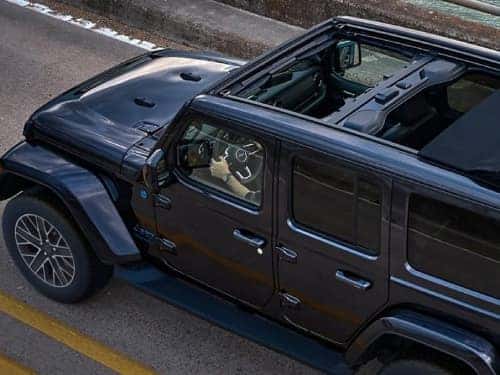 2024 Jeep Wrangler 4xe overhead view driving on a highway