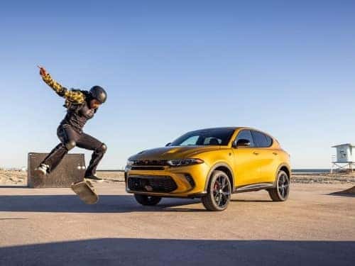 2024 Dodge Hornet parked at a skate park on a sunny day
