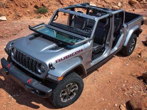 2024 Jeep Gladiator overhead view of vehicle parked in a desert terrain with top and windshield off
