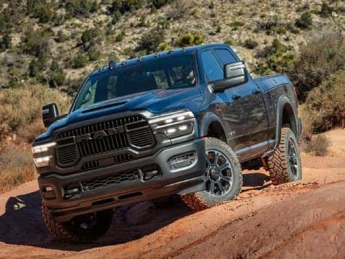 2025 RAM 2500 parked on red dirt terrain