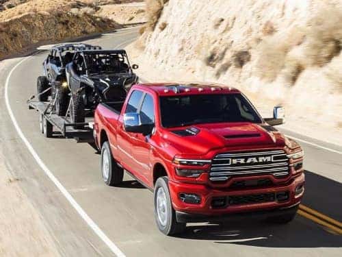 2025 RAM 2500 towing a side-by-side