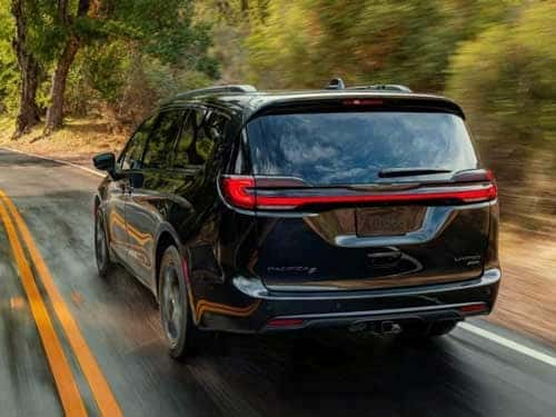2023 Chrysler Pacifica driving down the road