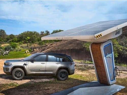 2024 Jeep Grand Cherokee 4xe parked at a charging station