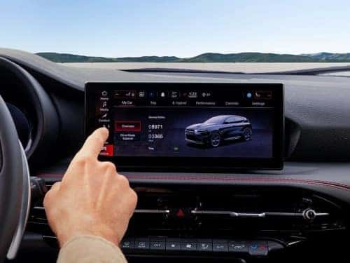 2024 Dodge Hornet close up view of person touching touchscreen display