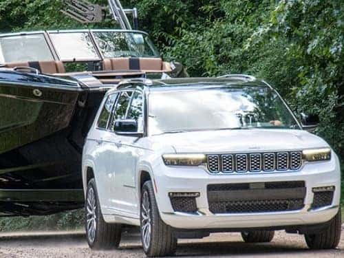 2024 Jeep Grand Cherokee 4xe towing a boat